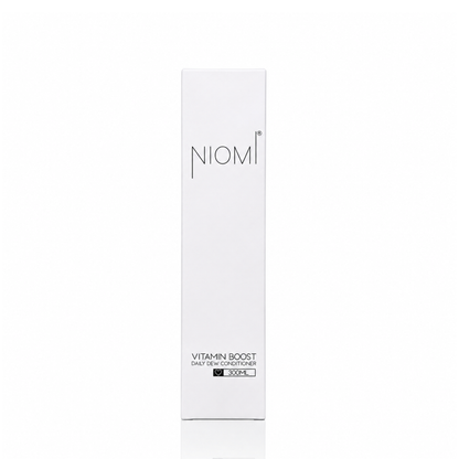 A tall, slim white rectangular box for NIOMI Vitamin Boost Daily Dew Conditioner featuring black text on a clean white background.