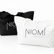 Two canvas tote bags on a white background, one black with white printed text and one white with black printed text. The white bag is in front and clearly shows the brand name 'NIOML AUSTRALIA'.